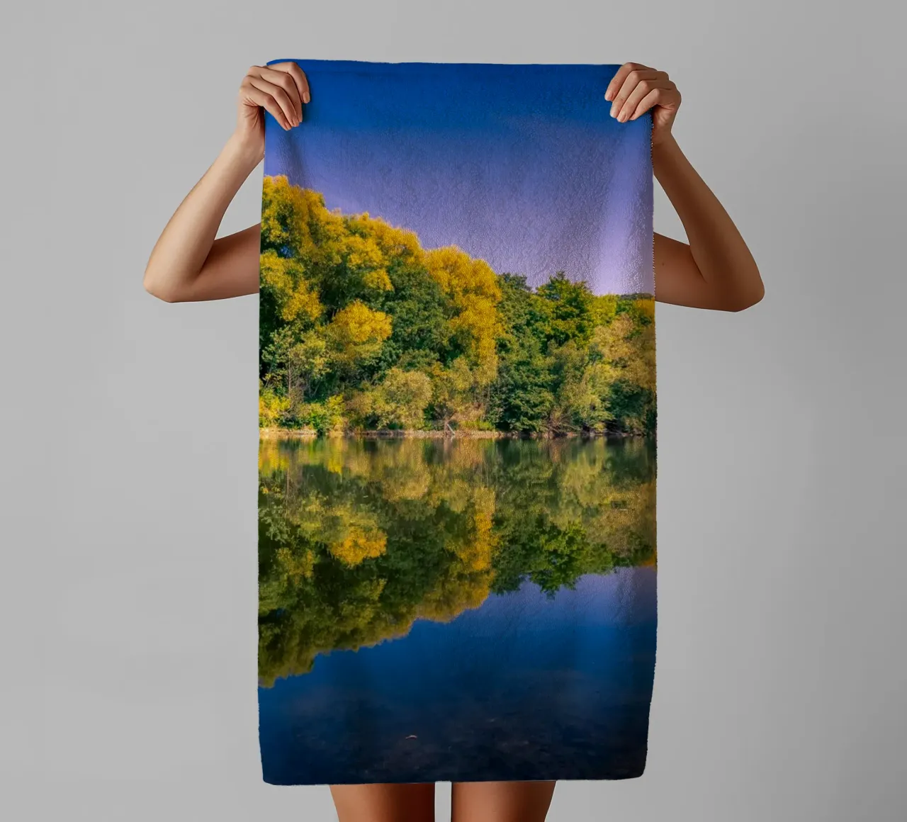 Reflection of trees in a small pond towel by Marcus Beckert | Fotografie