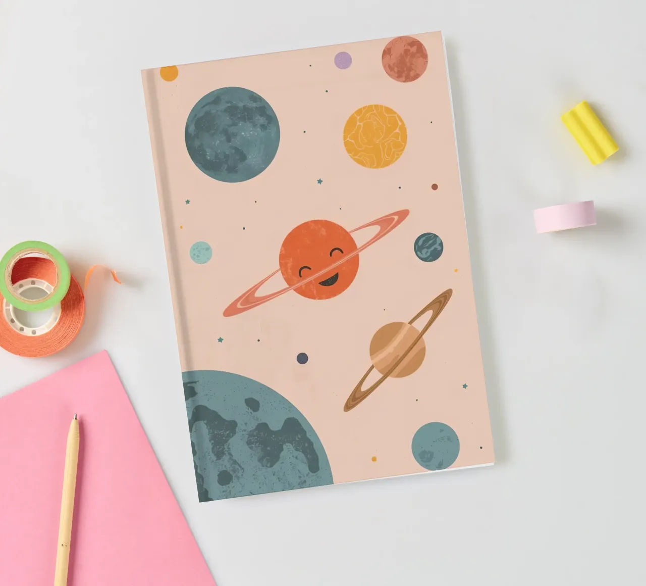 Planets with Rings and Stars on Peach Background notebook by DesignDoodle
