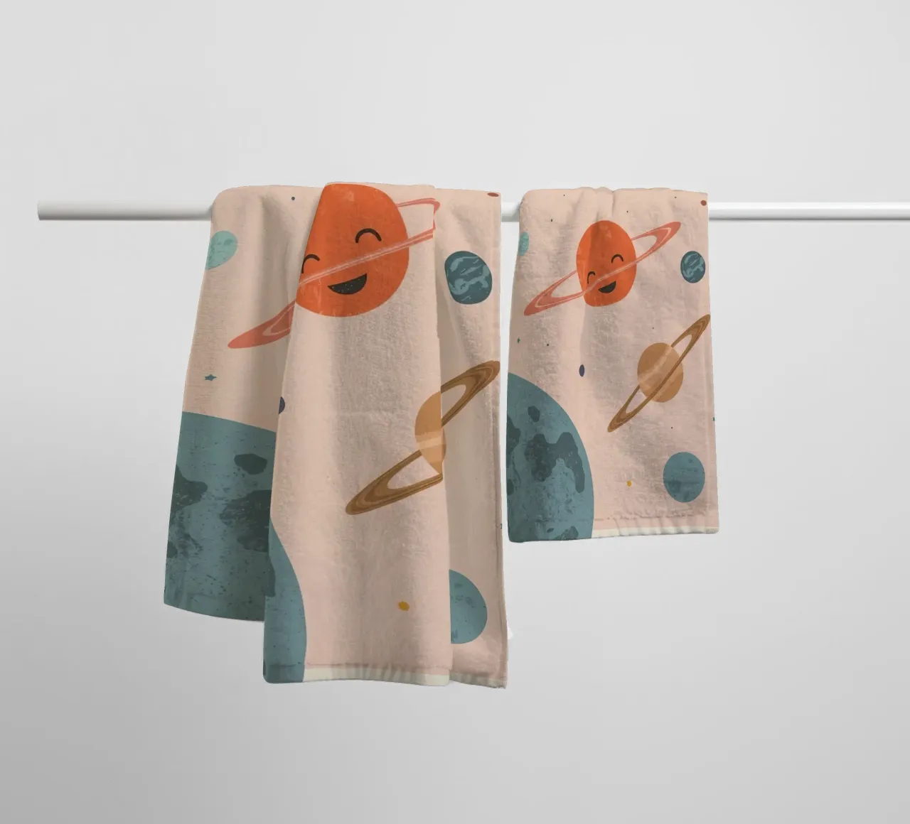 Planets with Rings and Stars on Peach Background towel by DesignDoodle