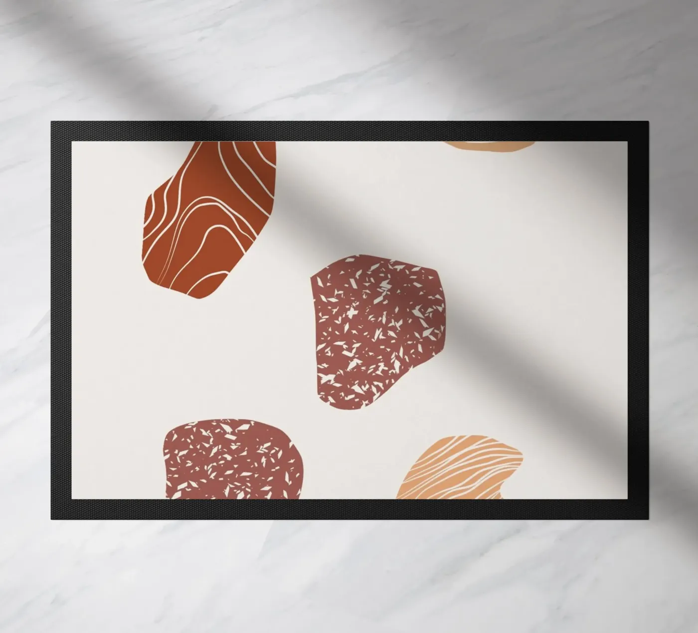 Pebble composition doormat by Little Dean