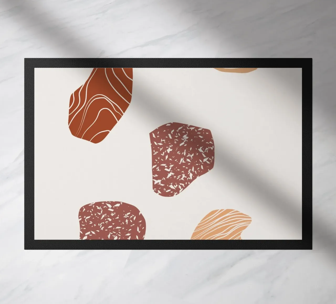 Pebble composition doormat by Little Dean