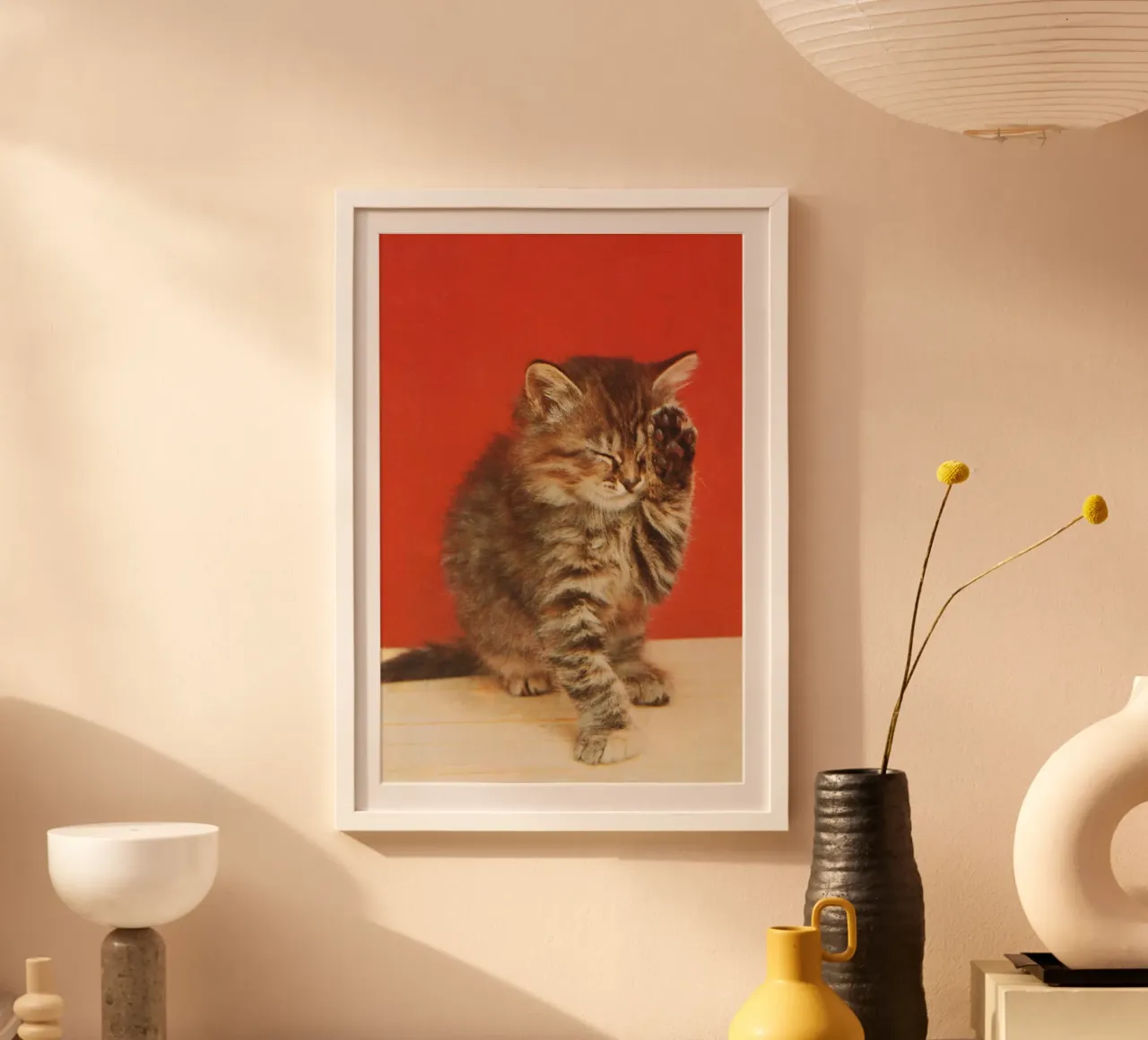 Cat with a paw up to its closed eyes poster con telaio in plastica da vintageshop