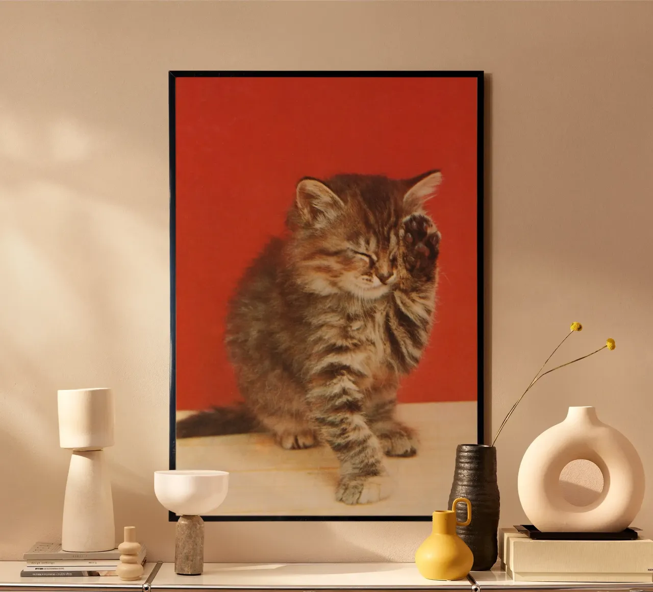 Cat with a paw up to its closed eyes poster con telaio in plastica da vintageshop