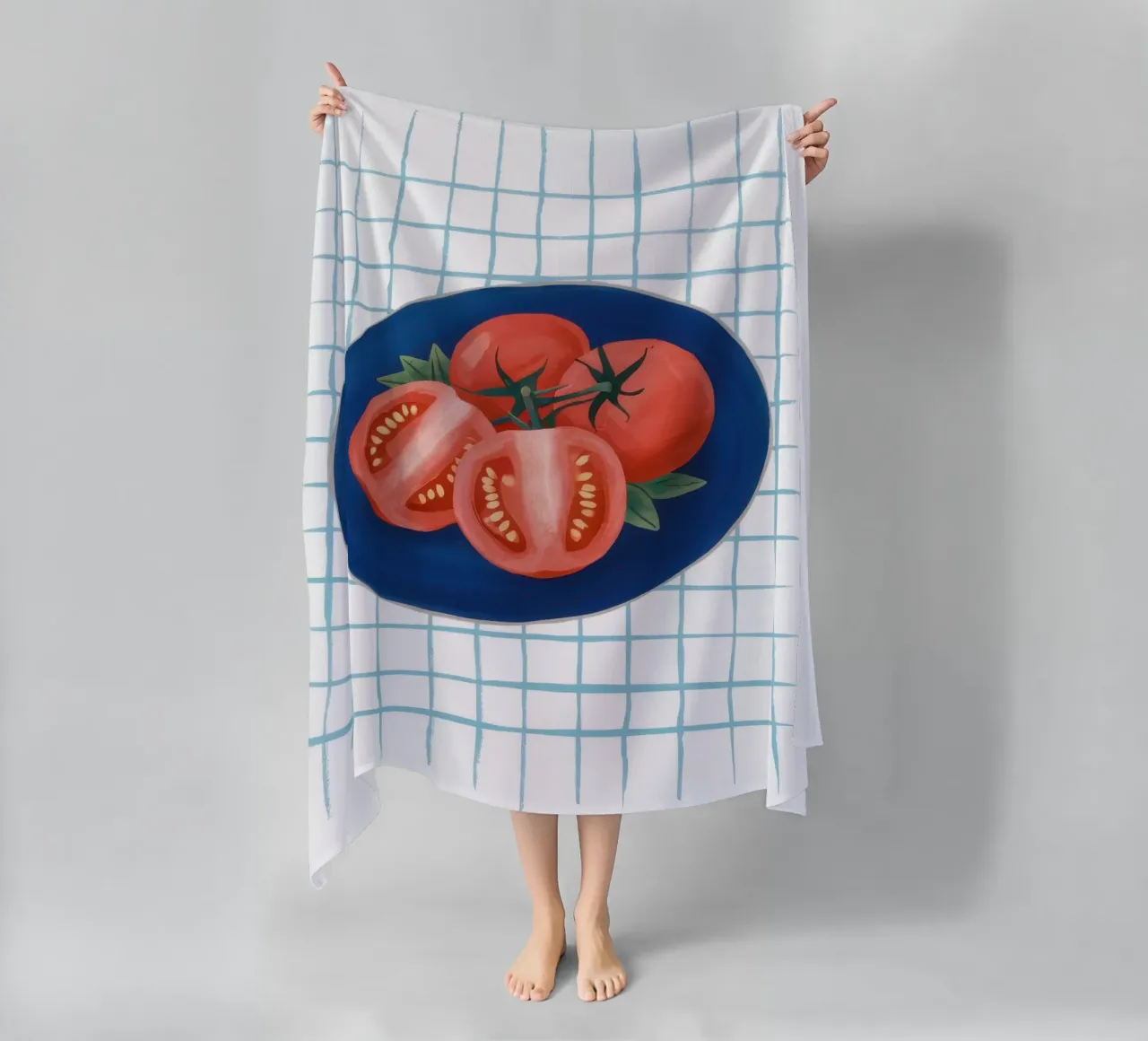 Pomodoro su piatto a scacchi telo mare da Frame Aura