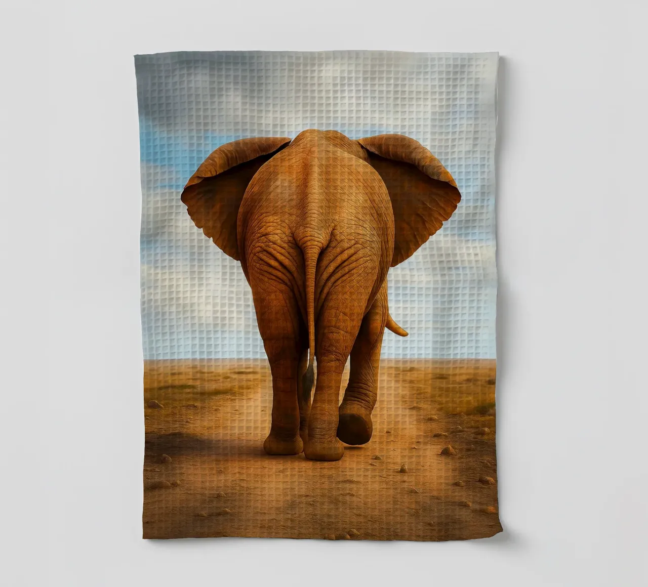 vue arrière d'un éléphant marchant torchon de landtengs