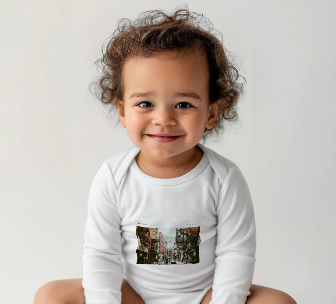 New York Pantone 471 long-sleeve baby romper by In Full Color