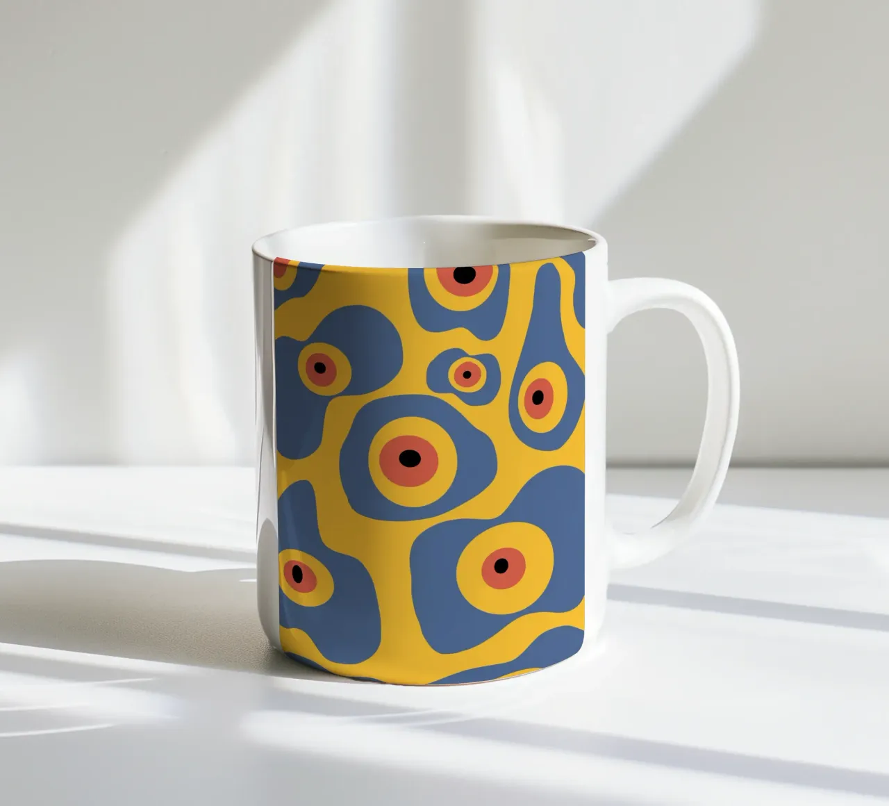Evil eye pattern ceramic mug by Little Dean