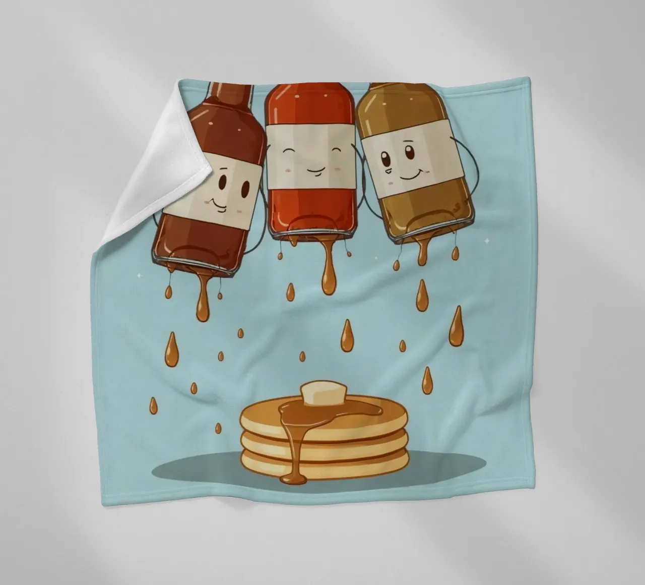 Simpatiche bottiglie che versano sciroppo sui pancake coperta in pile da DesignDoodle