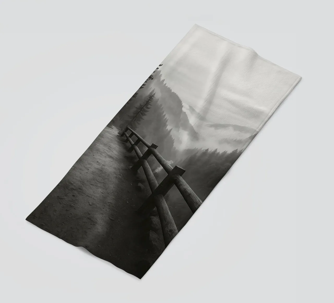 road on the edge of a cliff in the forest black and white ph beach towel by roosses