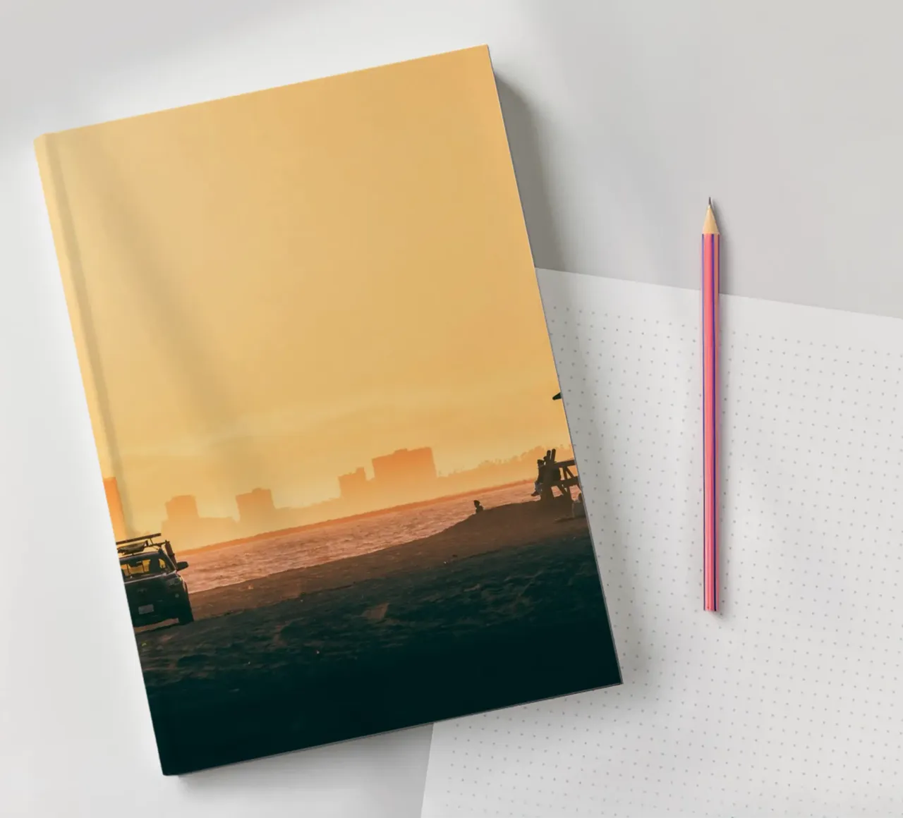Sunset Beach Scene with Skyline and Lifeguard Tower notebook by Alexander Wilson