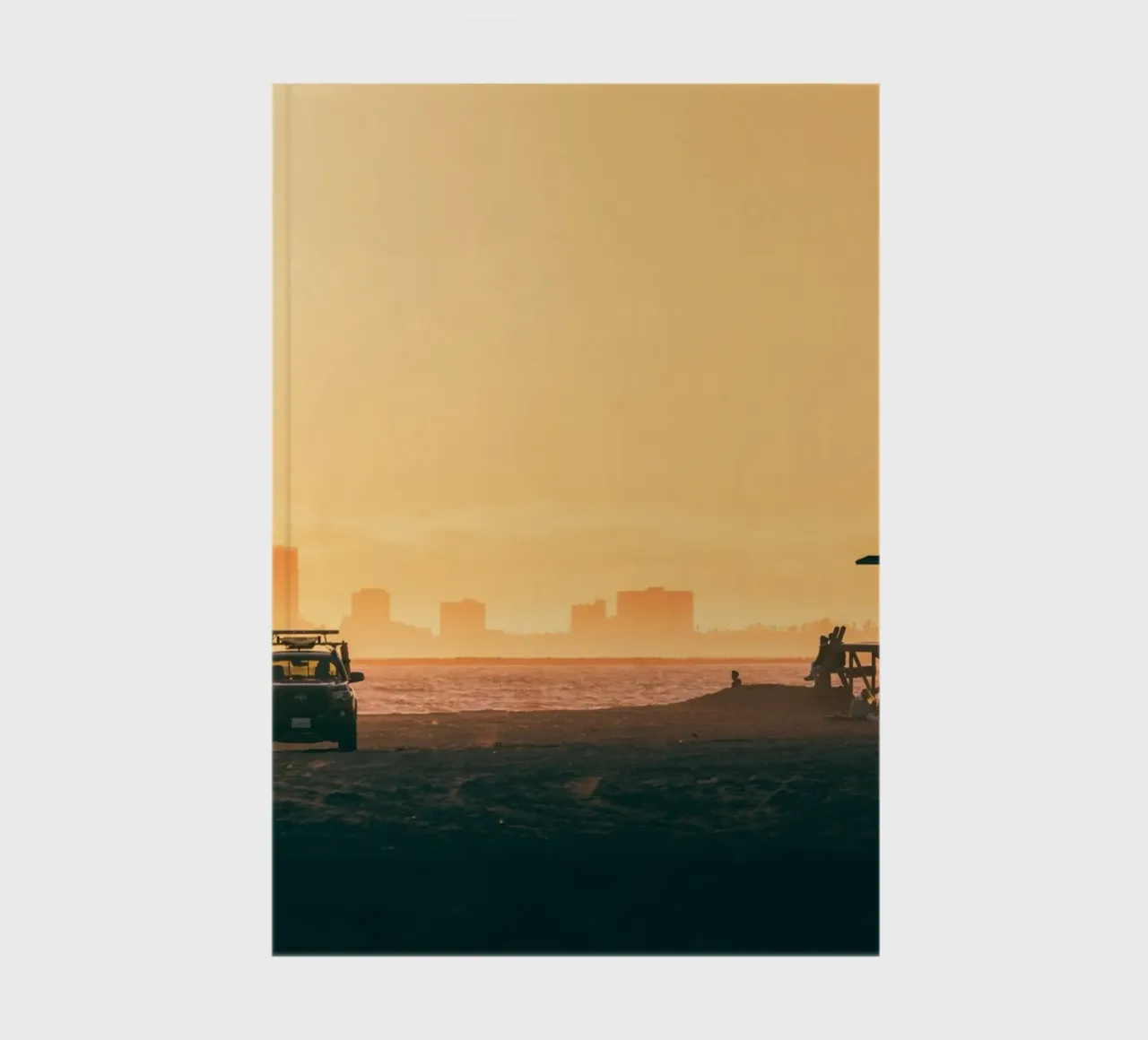 Sunset Beach Scene with Skyline and Lifeguard Tower notebook by Alexander Wilson