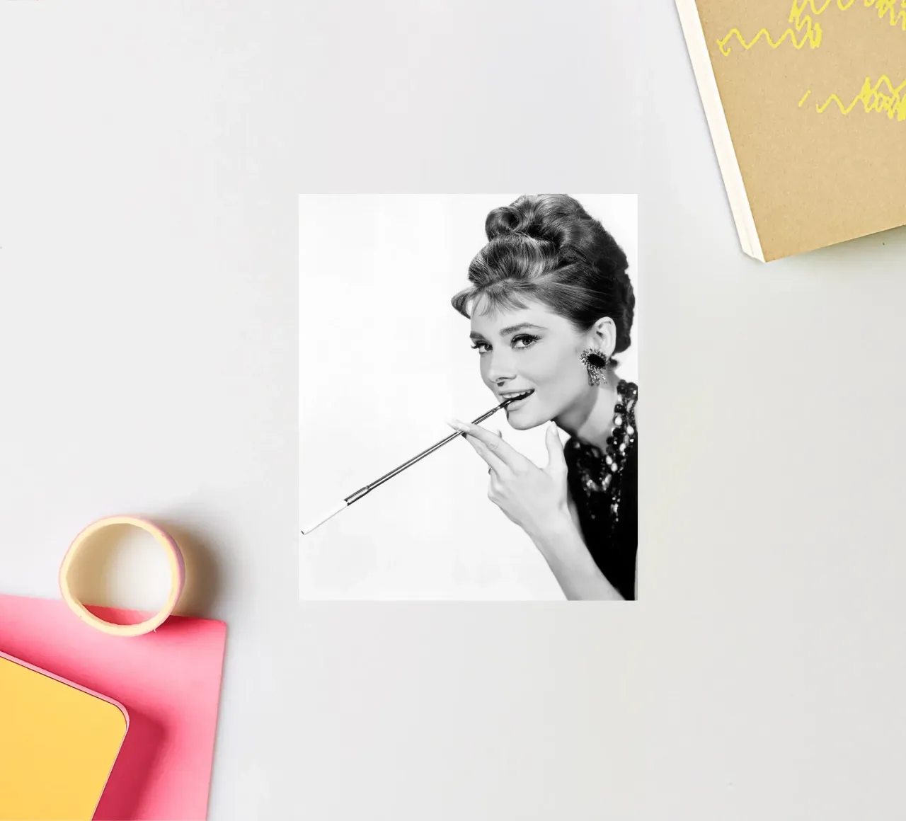 Audrey Hepburn mit Zigarettenspitze Sticker von April Lewis