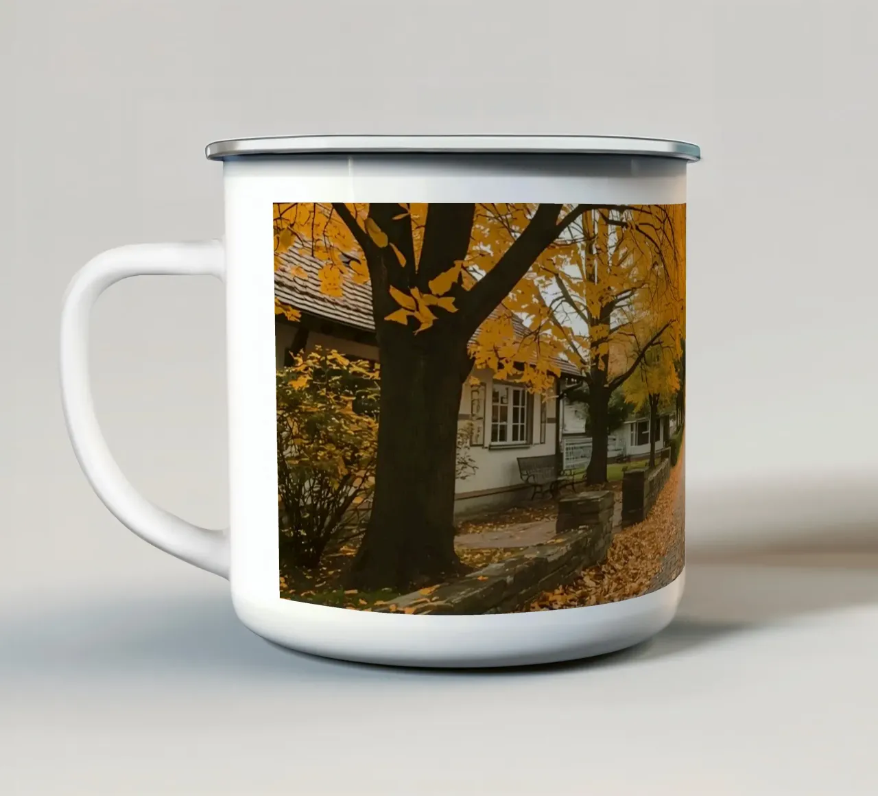 Cobblestone Path Lined with Autumn Trees and Houses enamel mug by DesignDoodle