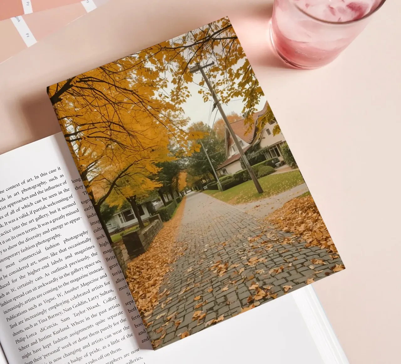 Cobblestone Path Lined with Autumn Trees and Houses notebook by DesignDoodle