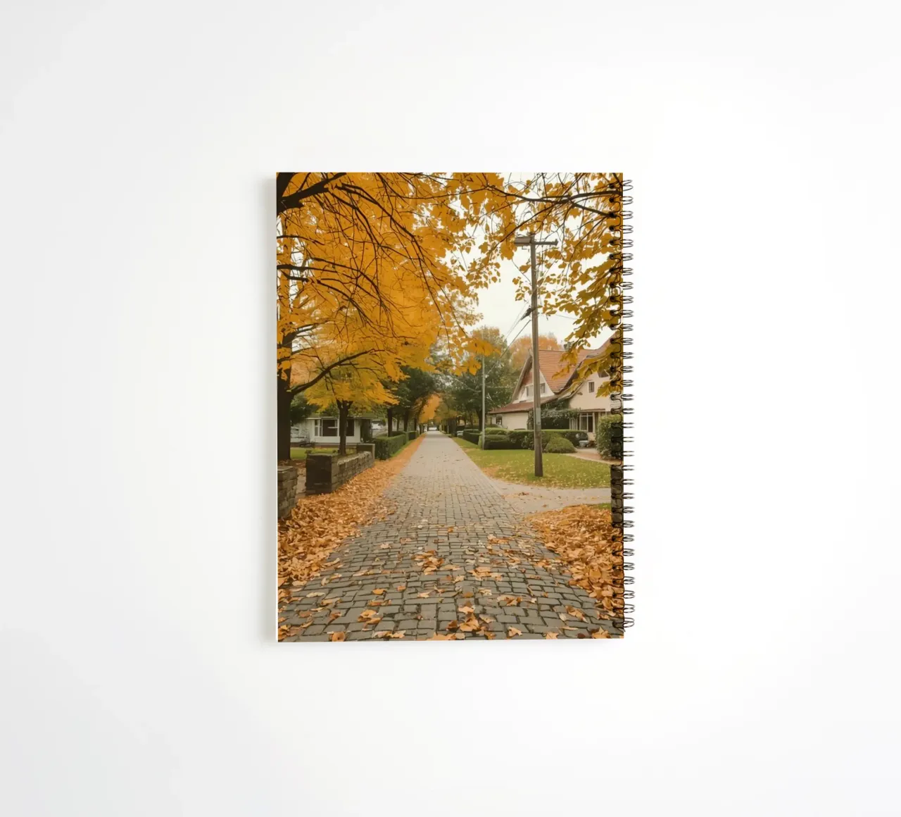 Cobblestone Path Lined with Autumn Trees and Houses spiral notebook by DesignDoodle