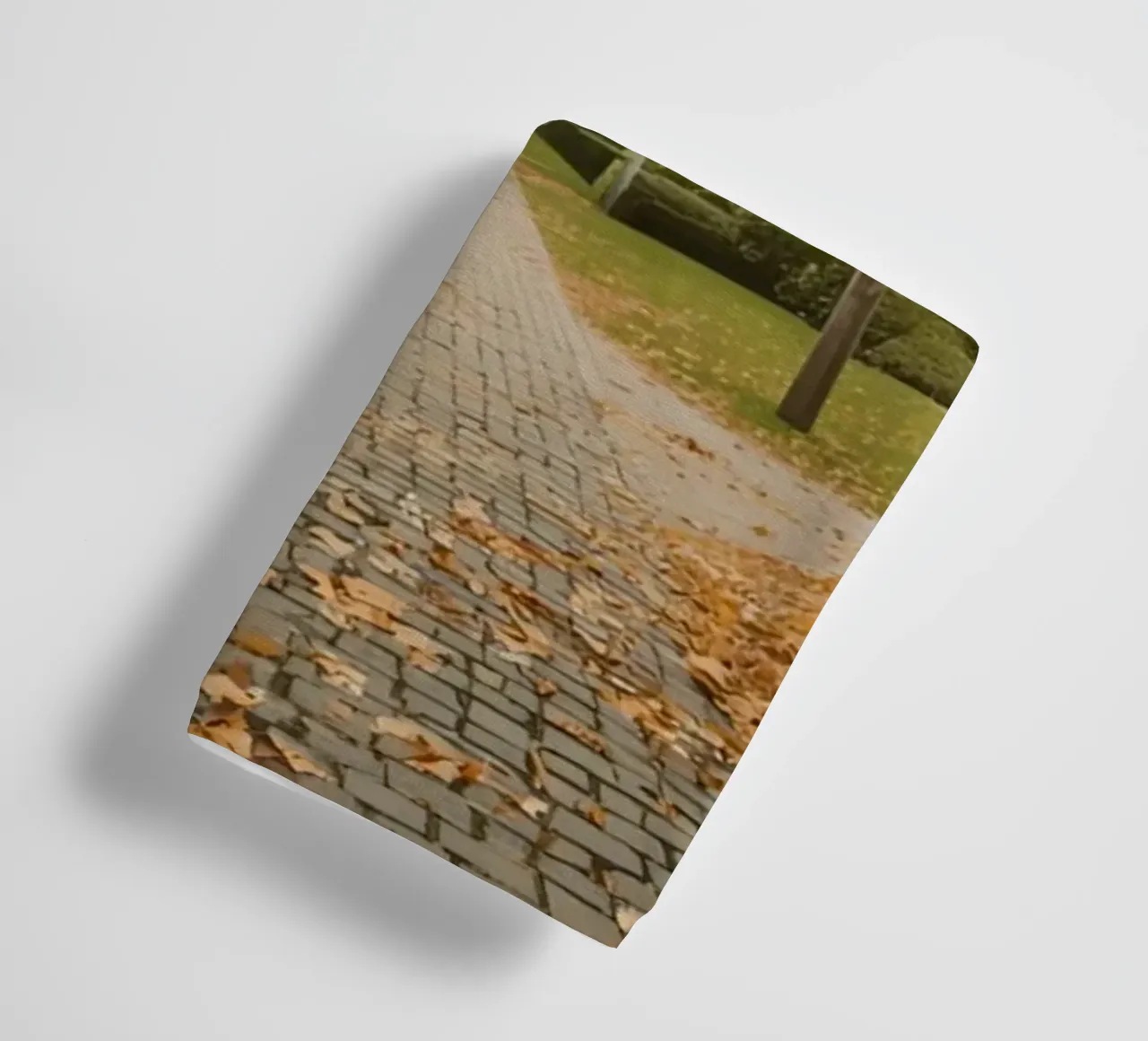 Cobblestone Path Lined with Autumn Trees and Houses towel by DesignDoodle