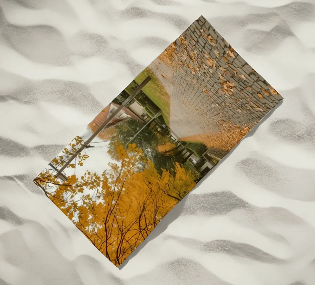 Cobblestone Path Lined with Autumn Trees and Houses beach towel by DesignDoodle