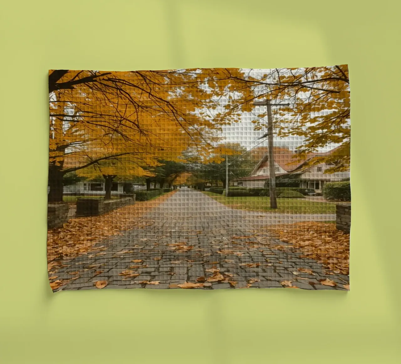 Cobblestone Path Lined with Autumn Trees and Houses tea towel by DesignDoodle