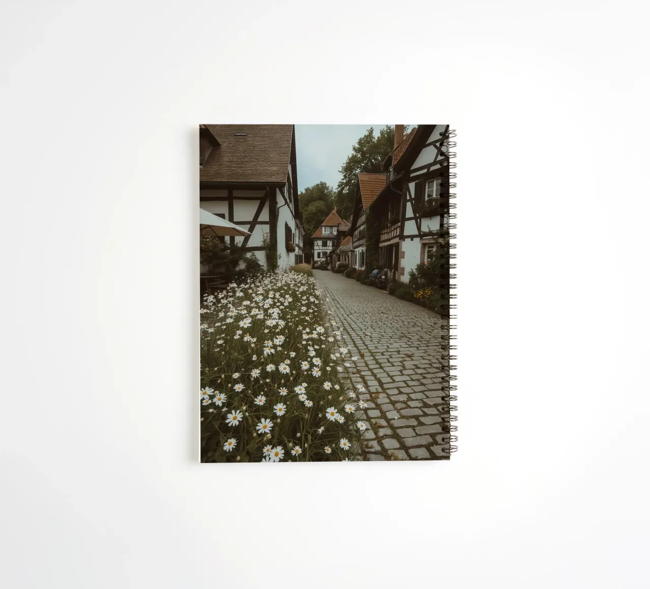 Cobblestone Path Lined with Autumn Trees and Houses spiral notebook by DesignDoodle