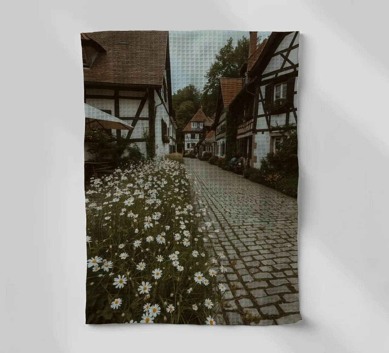 Cobblestone Path Lined with Autumn Trees and Houses tea towel by DesignDoodle