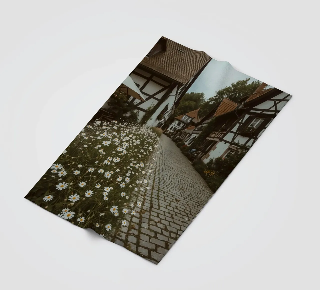Cobblestone Path Lined with Autumn Trees and Houses fleece blanket by DesignDoodle