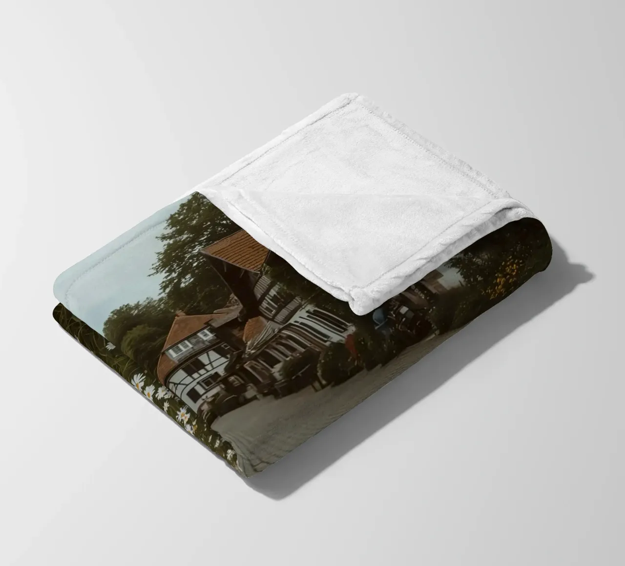 Cobblestone Path Lined with Autumn Trees and Houses fleece blanket by DesignDoodle
