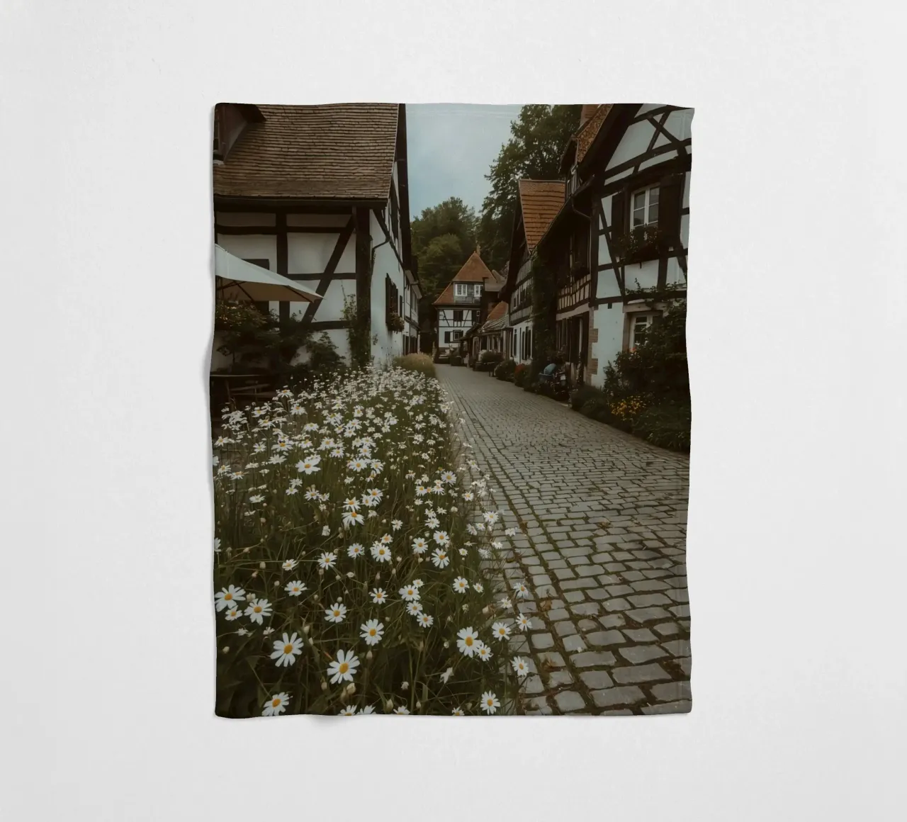 Cobblestone Path Lined with Autumn Trees and Houses fleece blanket by DesignDoodle