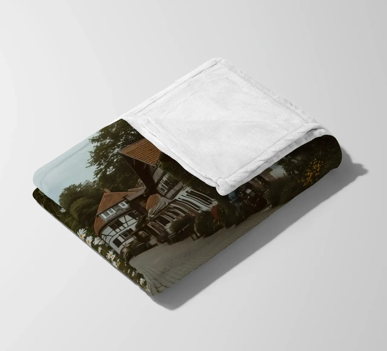 Cobblestone Path Lined with Autumn Trees and Houses fleece blanket by DesignDoodle