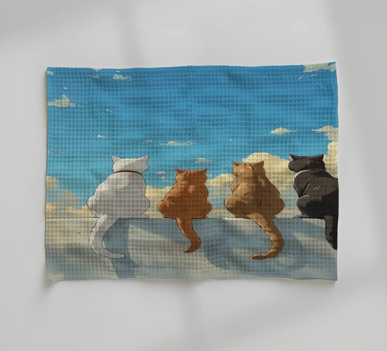 Quatre chats assis sur une corniche dans un ciel nuageux torchon de DesignDoodle