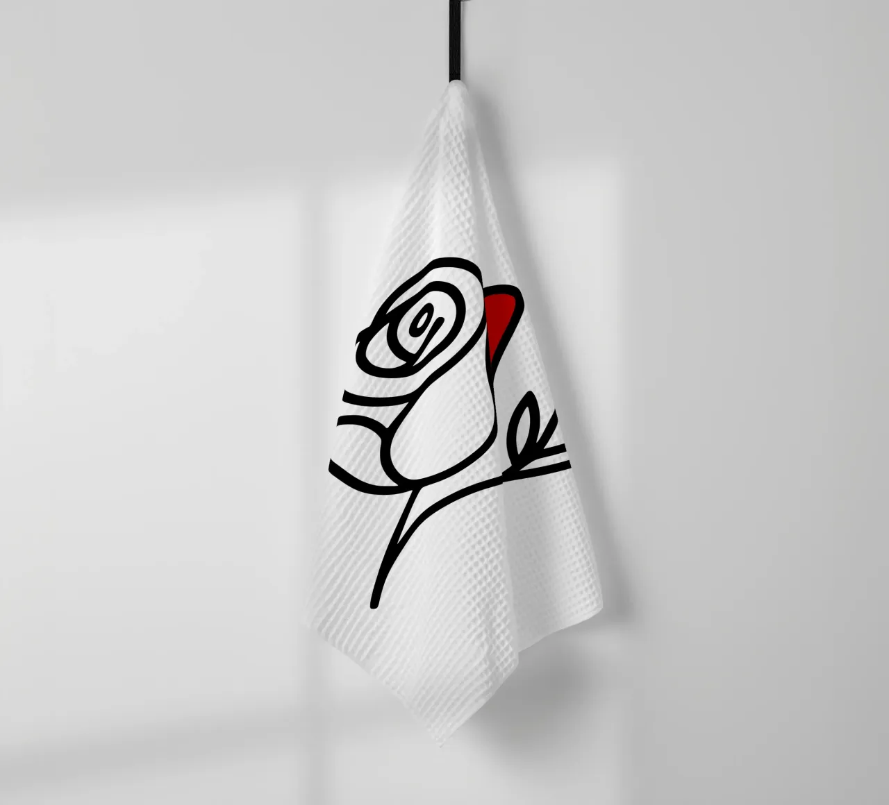 Minimalist reclining rose with a red leaf tea towel by Bold & Simple