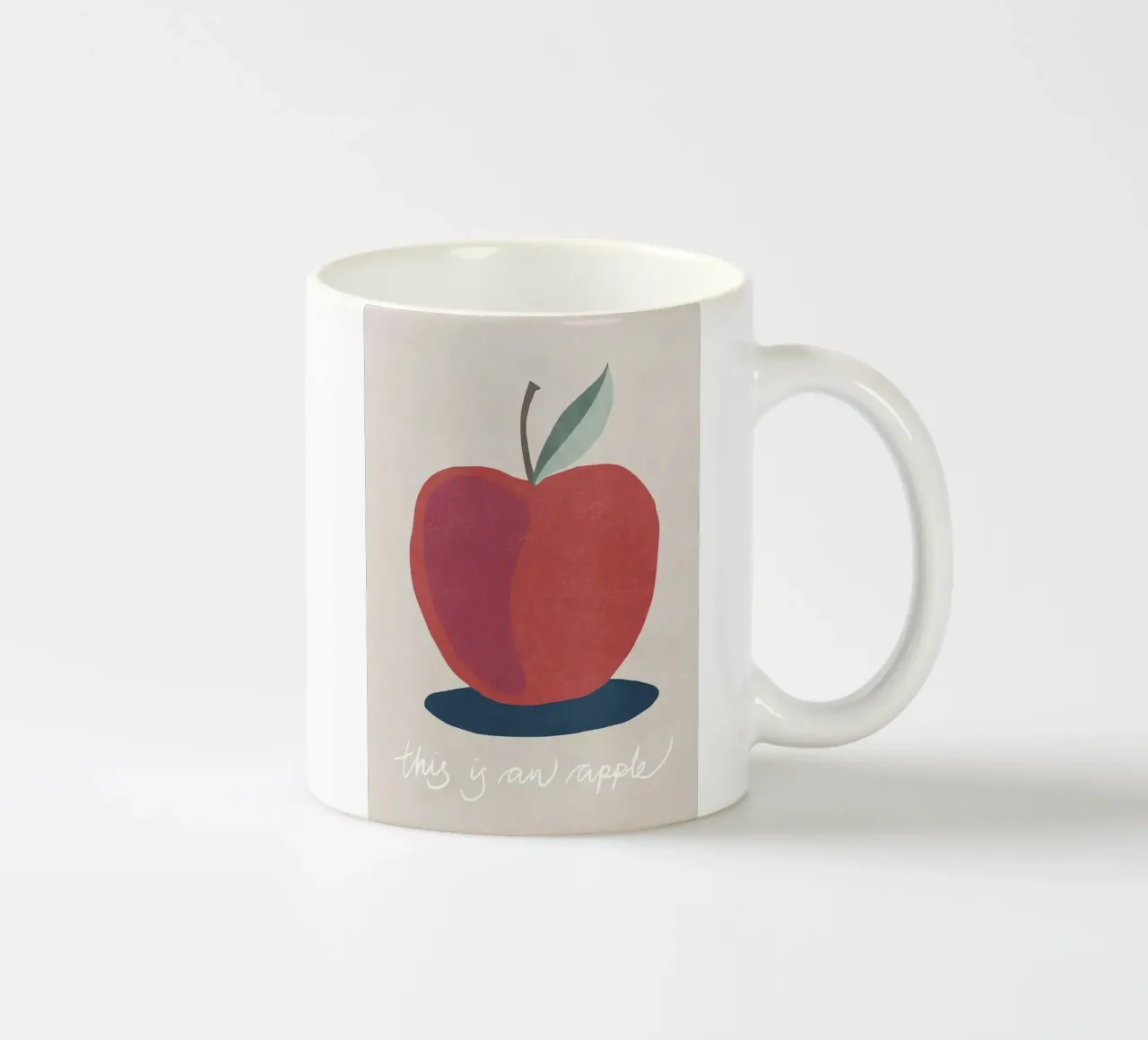 Questa è una Apple tazza in ceramica da Charlotte Gagnon
