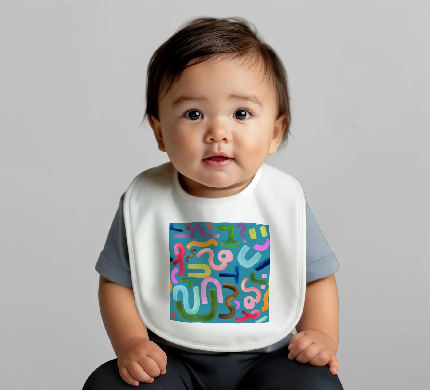 Abstract face baby bib by kosarandrea