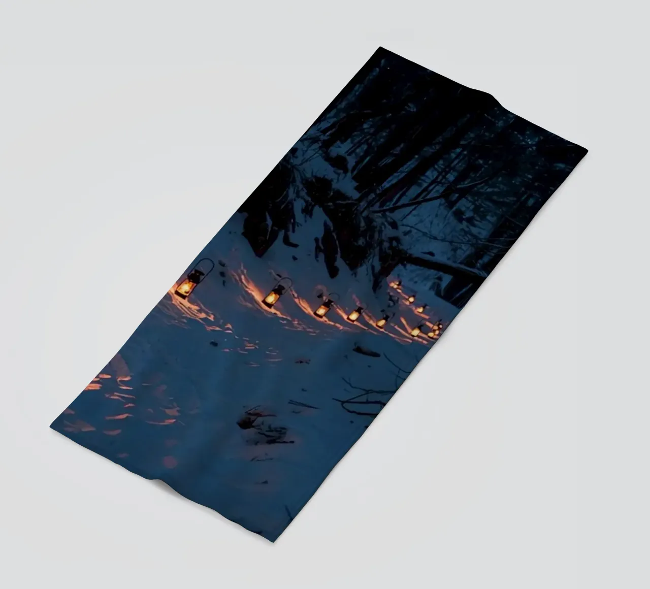 Snowy Forest Path Lined with Lanterns beach towel by DesignDoodle