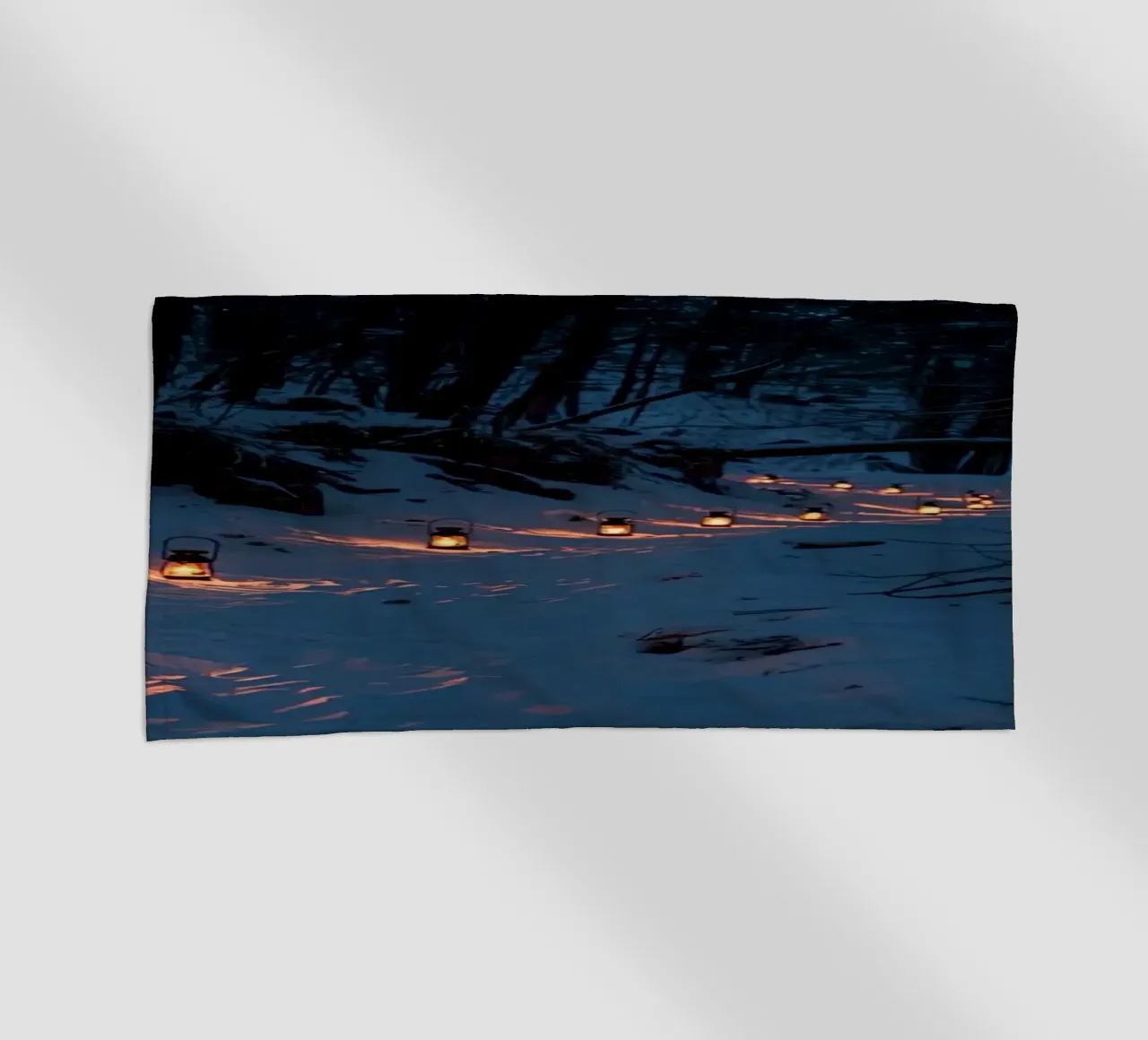 Snowy Forest Path Lined with Lanterns beach towel by DesignDoodle