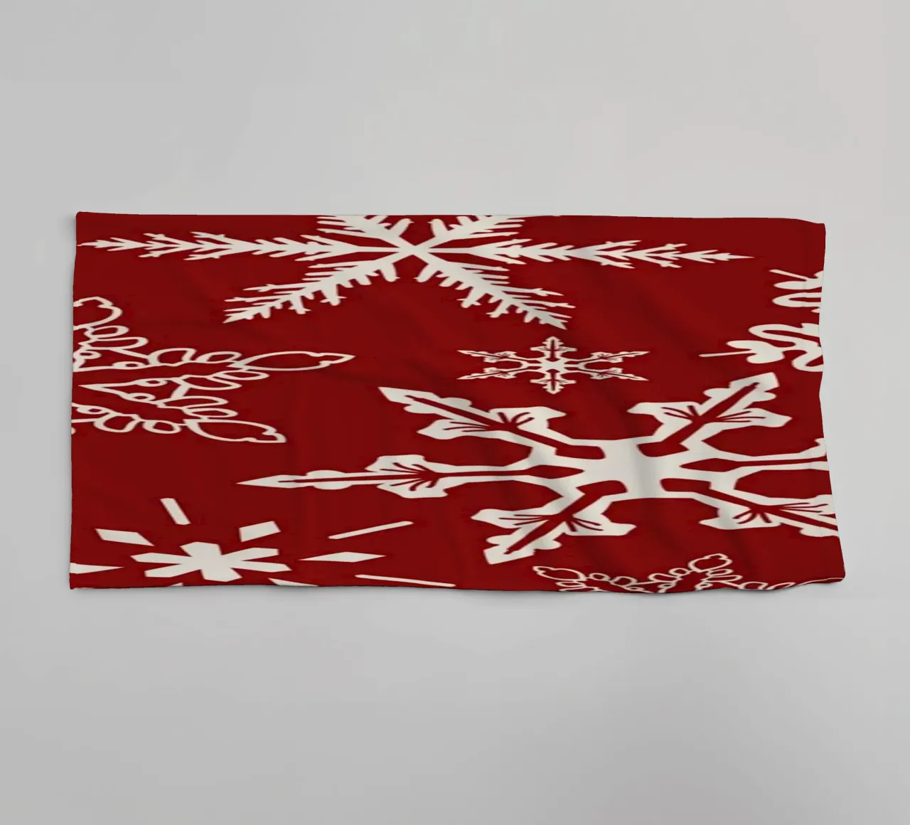 Red Background with White Snowflakes in Festive Winter Style towel by Stilrausch