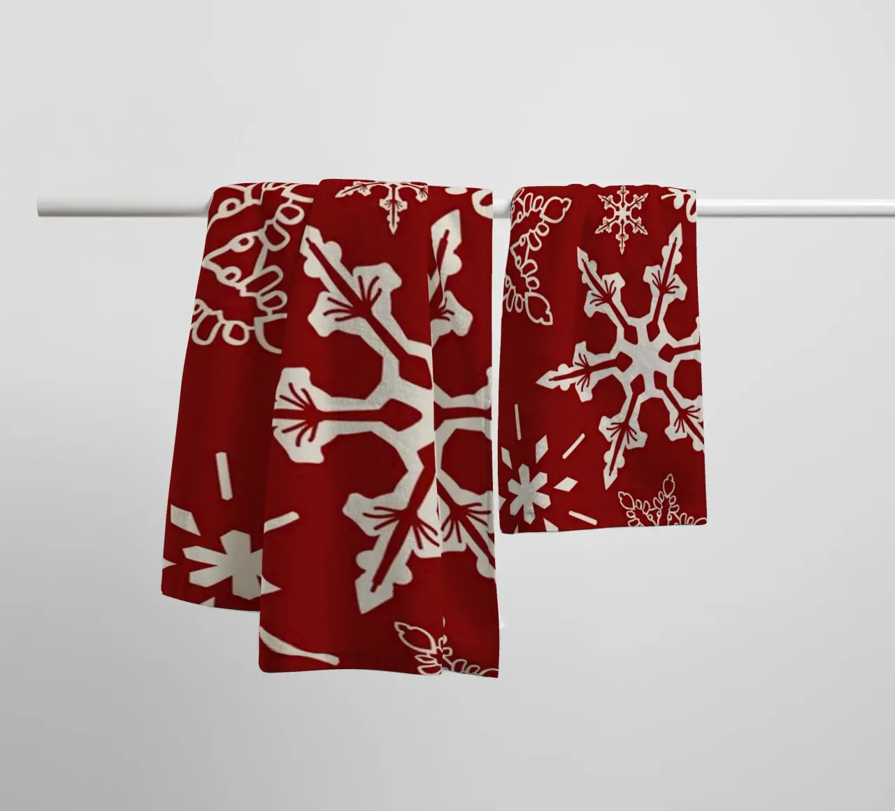 Red Background with White Snowflakes in Festive Winter Style towel by Stilrausch