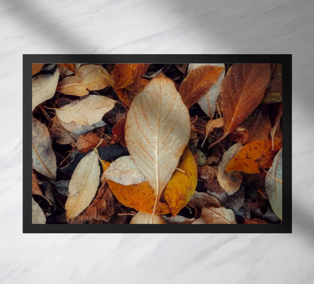 a red leaf doormat by Earthly Visions