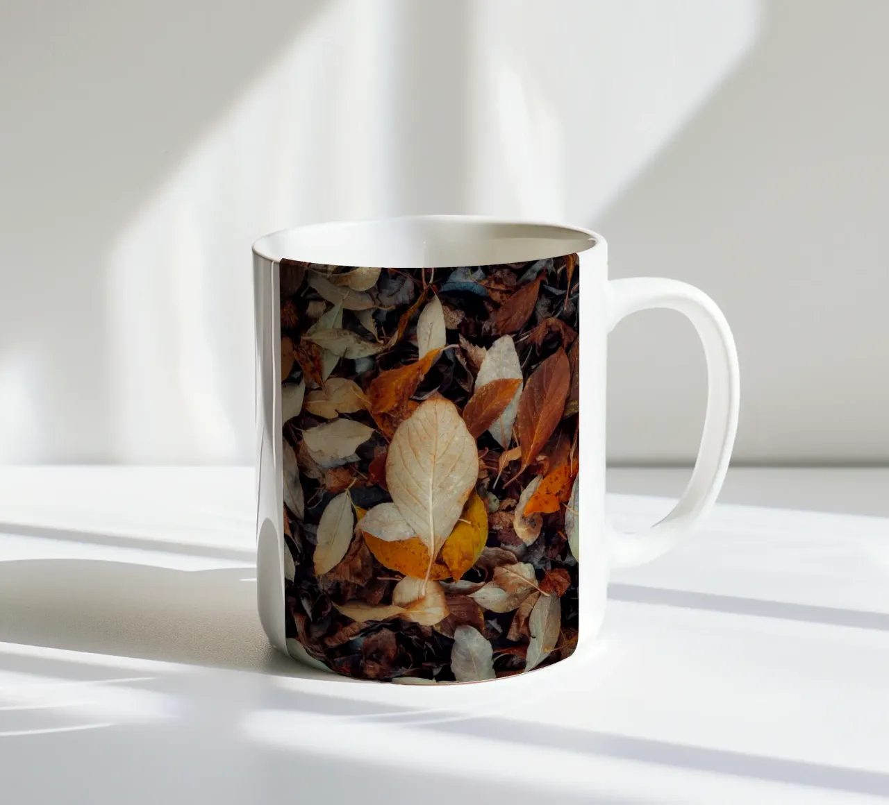 a red leaf ceramic mug by Earthly Visions