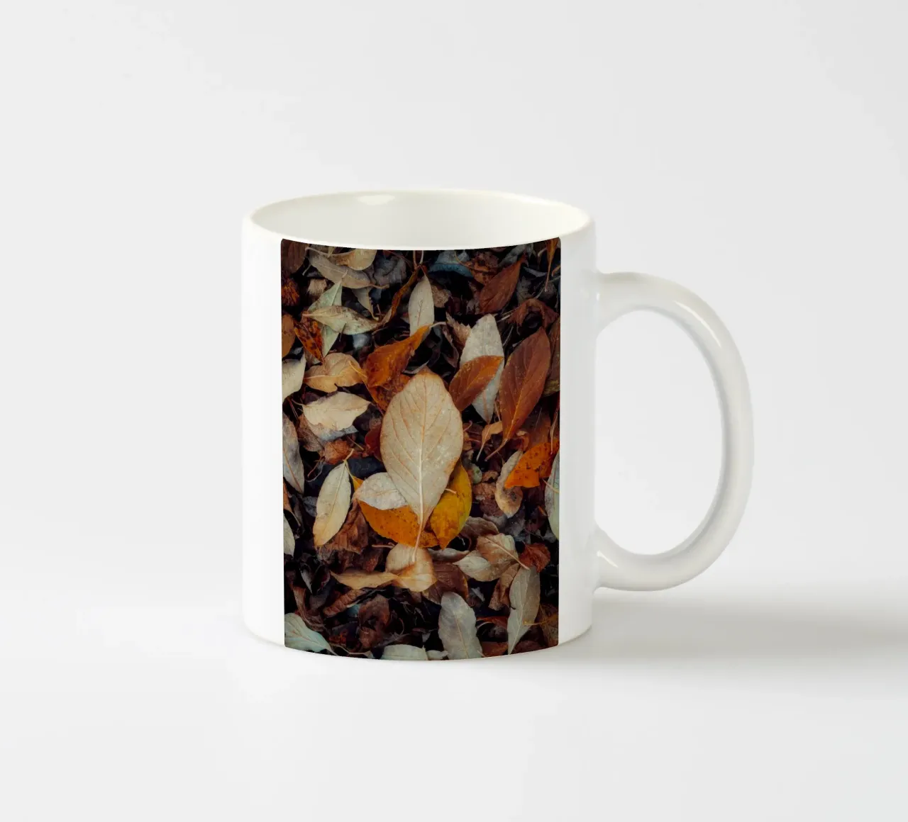 a red leaf ceramic mug by Earthly Visions