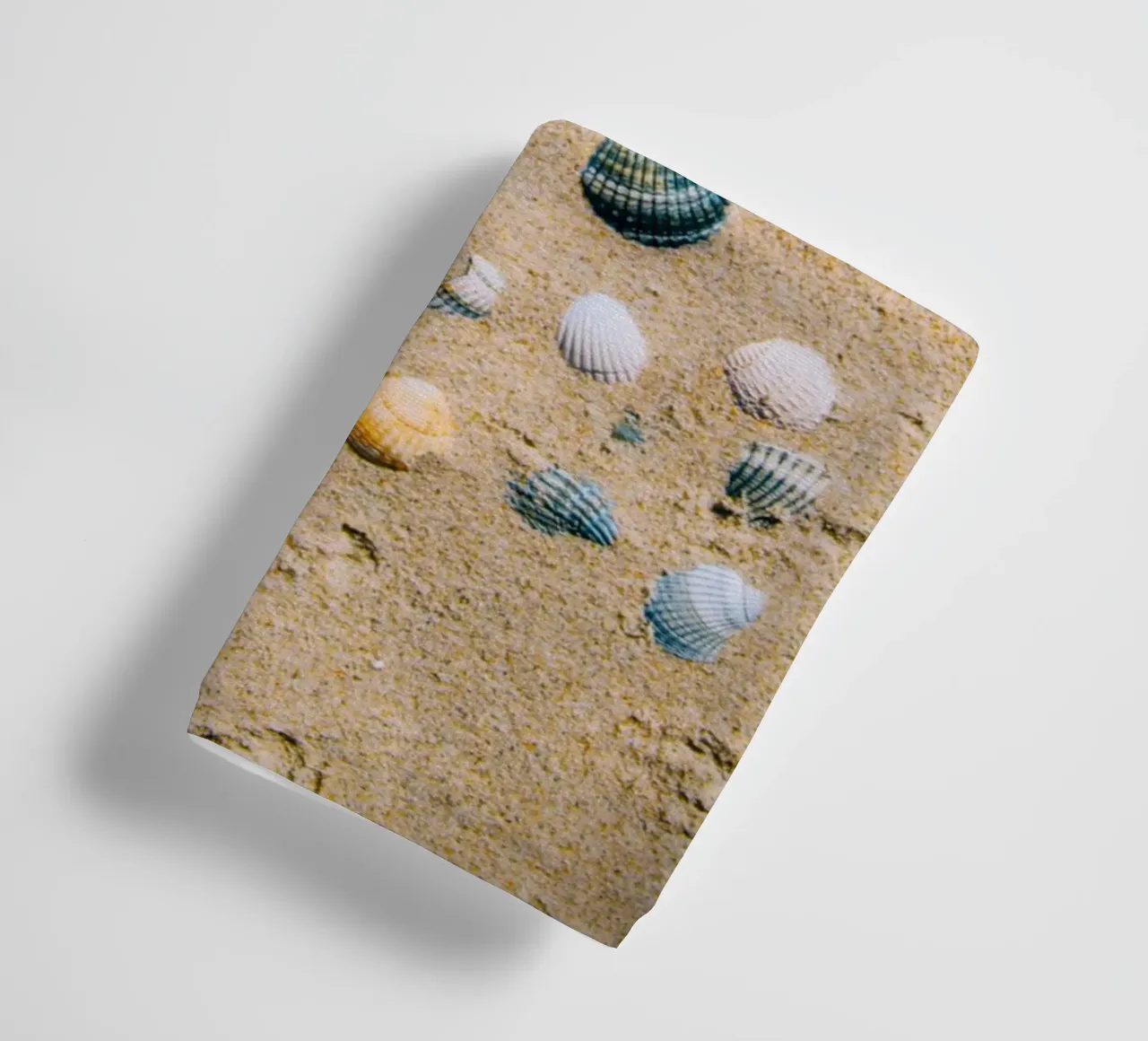 Shells on the sand – the ocean's eternal mark towel by Nature's Palette