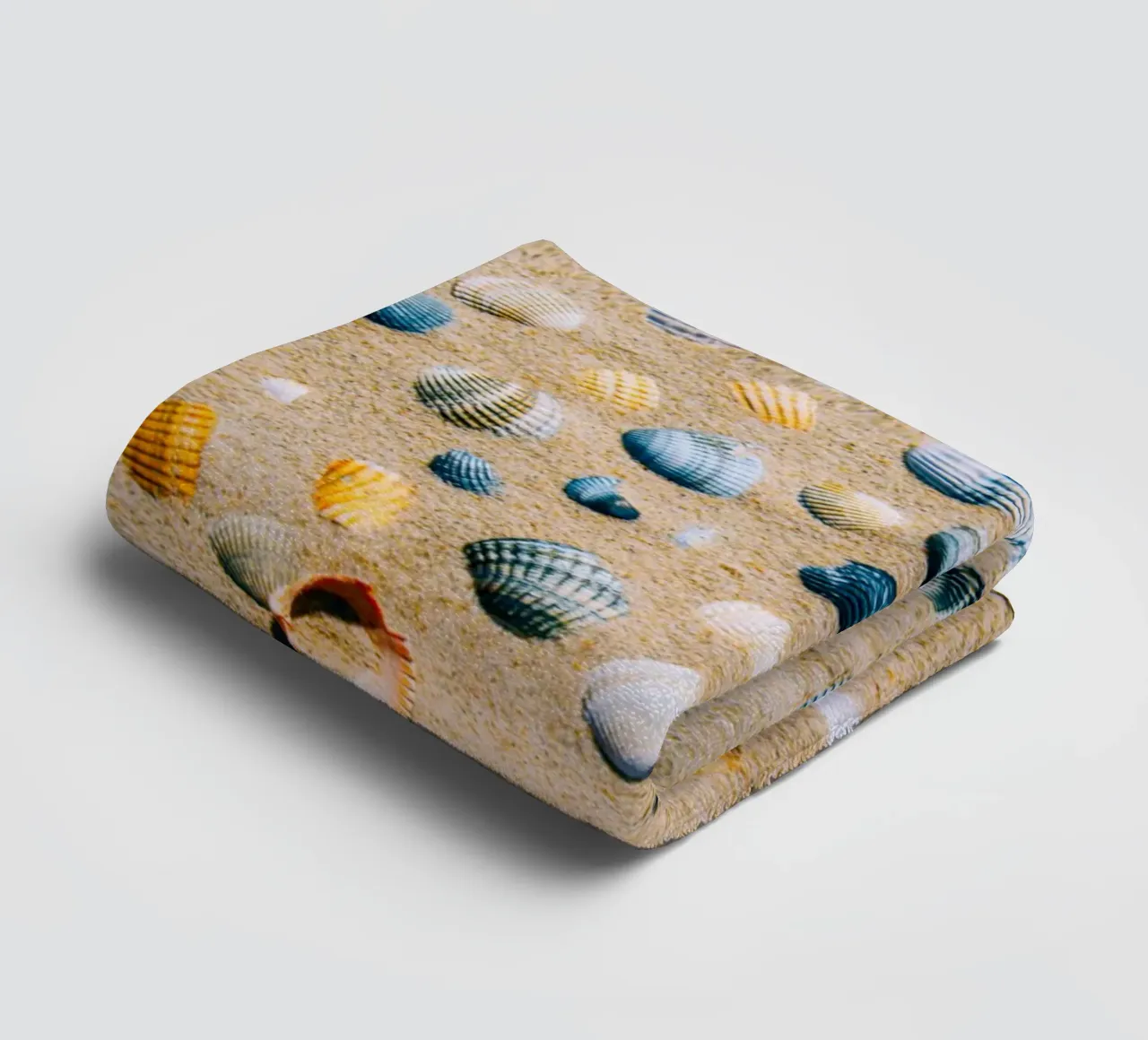 Shells on the sand – the ocean's eternal mark towel by Nature's Palette