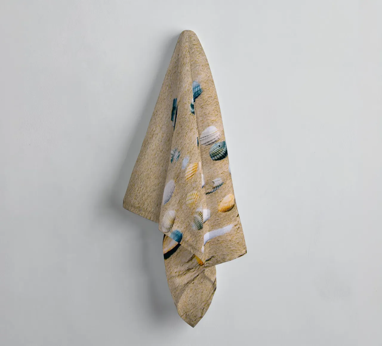 Shells on the sand – the ocean's eternal mark towel by Nature's Palette