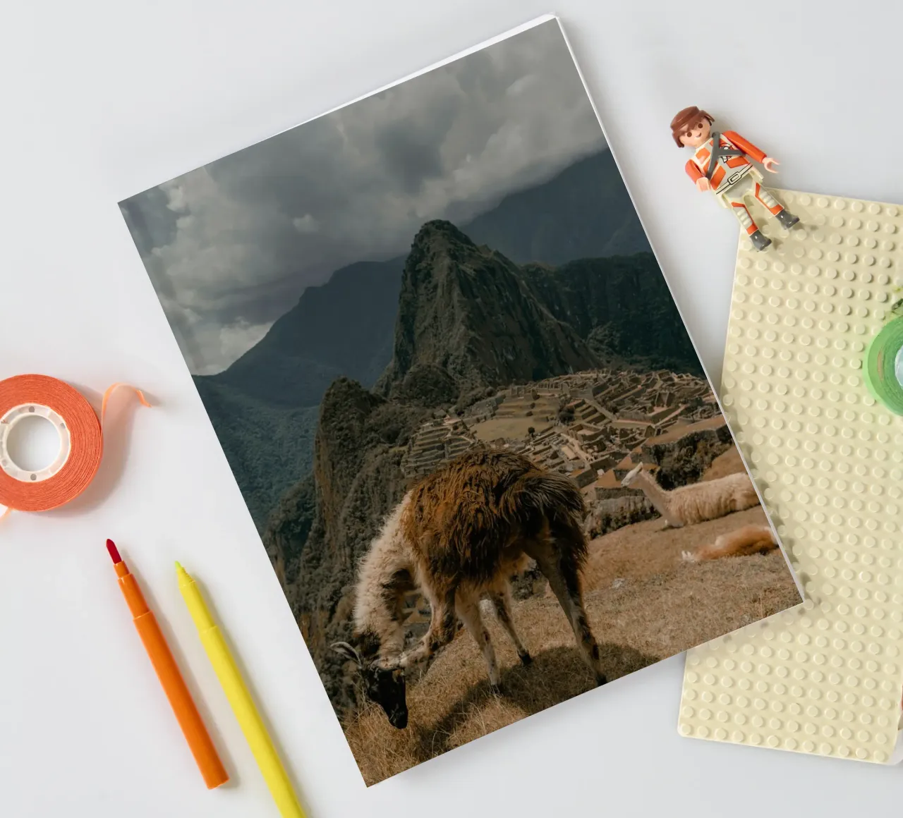 Llamas Grazing in the Foreground of Machu Picchu notebook by The Herringstore