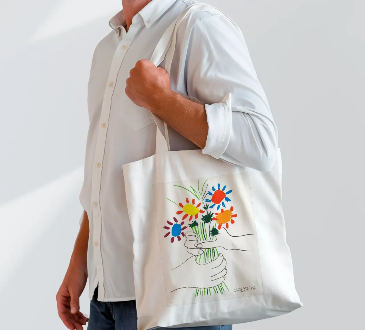 due mani che tengono un fiore di Picasso borsa in juta da eternal nino