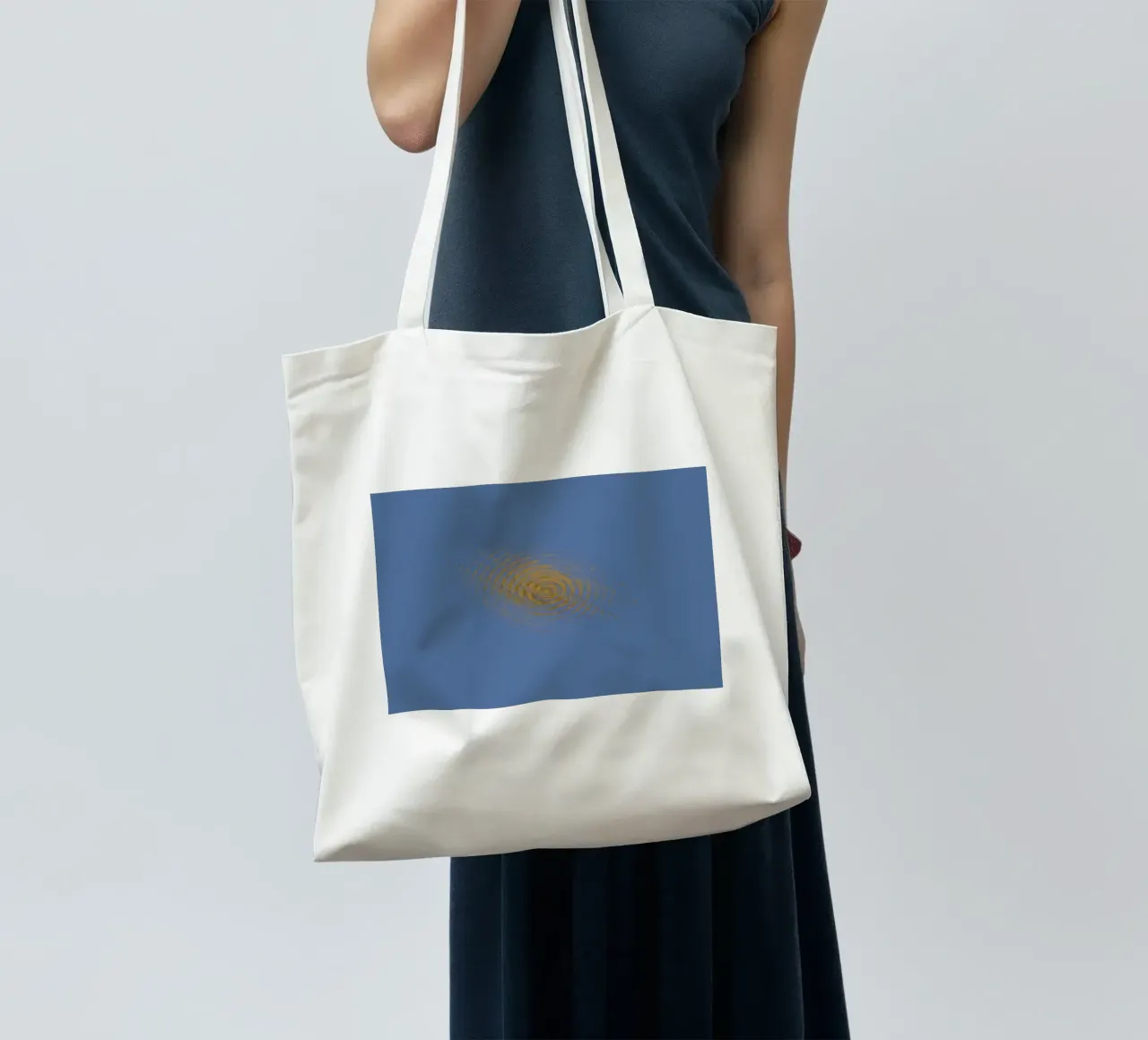 Abstract dynamic circular pattern in blue and yellow tote bag by Something for you