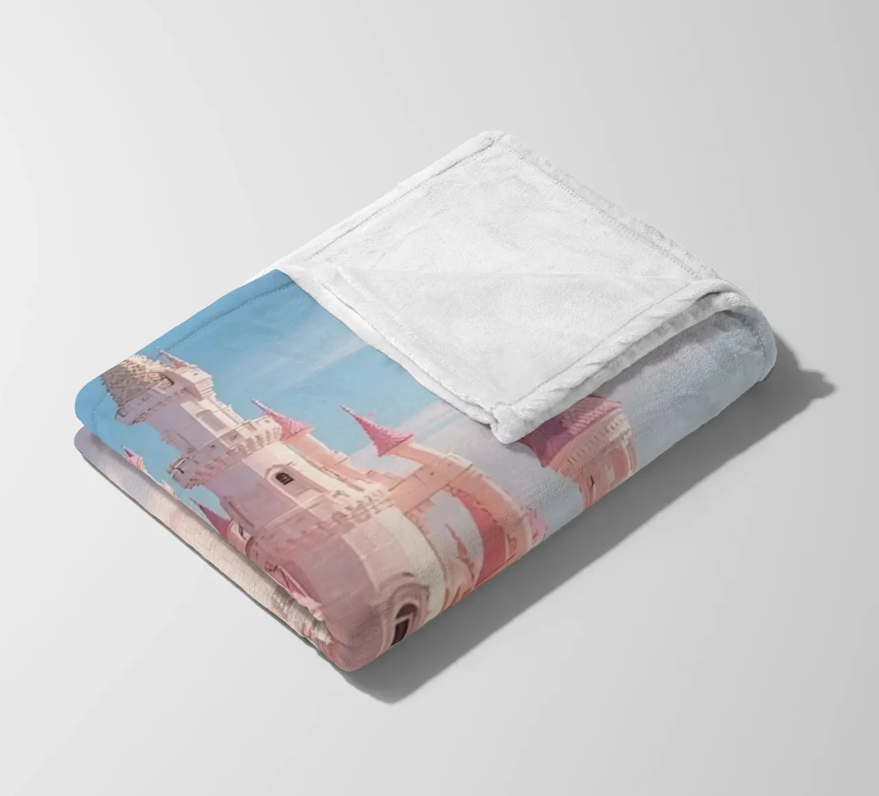 Castle floating on clouds with rainbow fleece blanket by DesignDoodle
