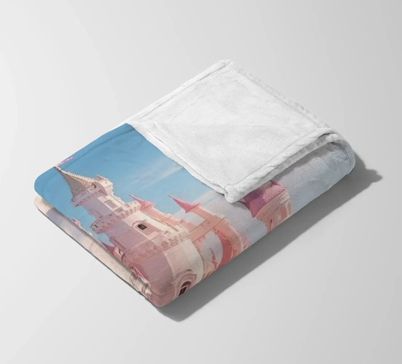 Castle floating on clouds with rainbow fleece blanket by DesignDoodle