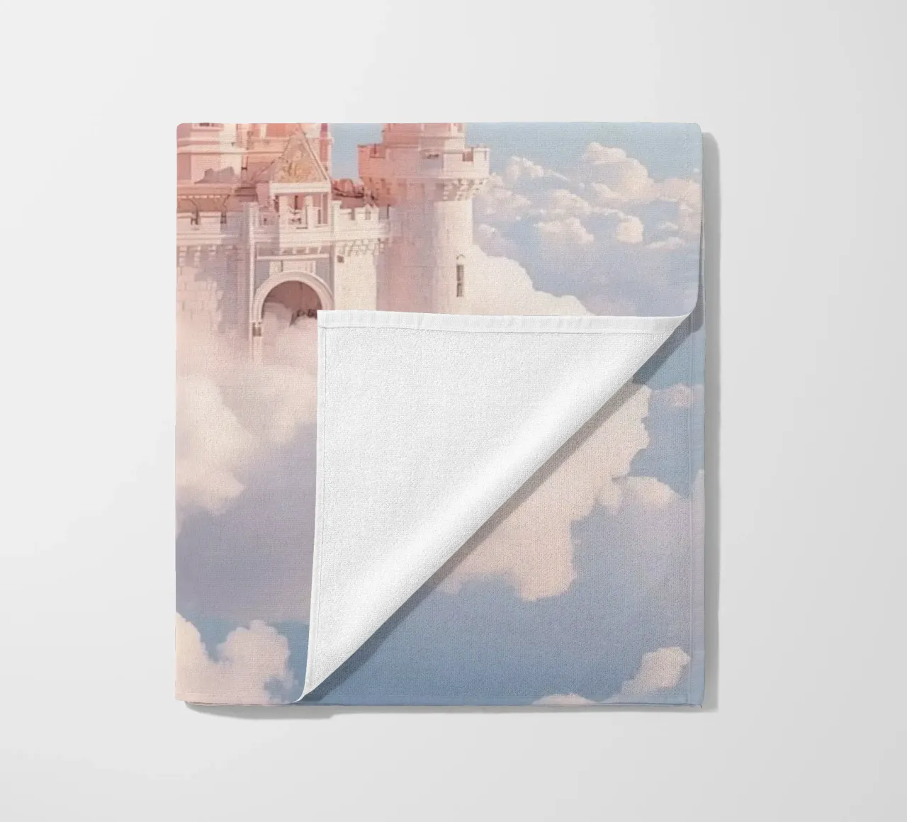Castle floating on clouds with rainbow beach towel by DesignDoodle