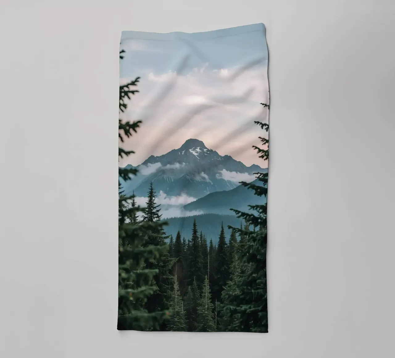 Coniferous Forest Framing Snow-Capped Mountain Peak towel by DesignDoodle