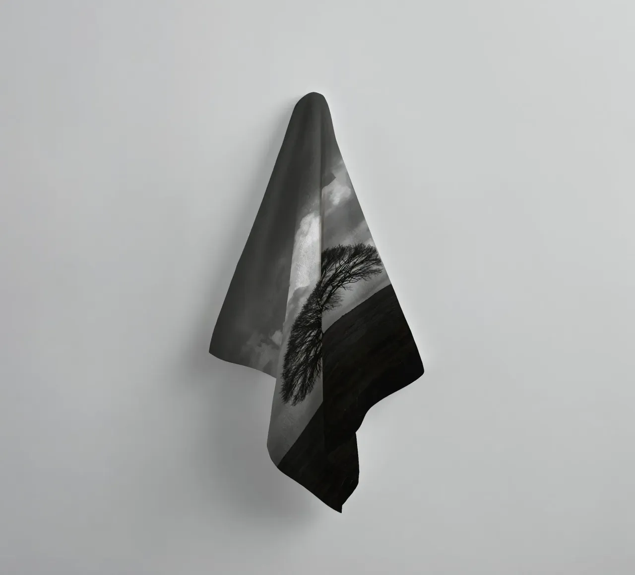 Deciduous Tree on Grassy Hill Under Cloudy Sky towel by DesignDoodle